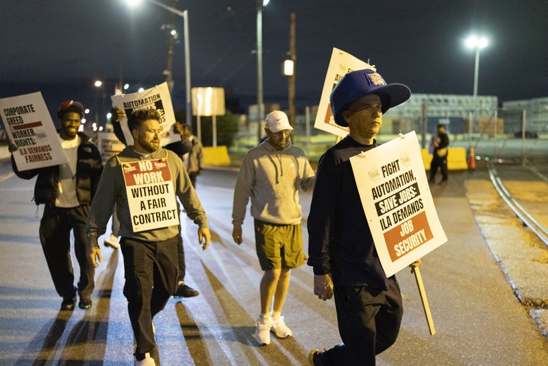 Striking Philadelphia longshoreman picket outside the Packer Avenue Marine Terminal Port, Tuesday, Oct. 1, 2024.(AP Photo/Ryan Collerd)