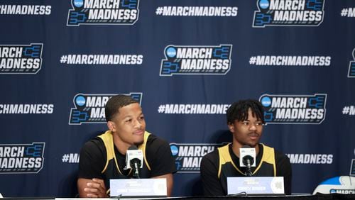 Kennesaw State guards Chris Youngblood, left, and  Terrell Burden speak to members of the media at the Greensboro Coliseum, Thursday, March 16, 2023, in Greensboro, North Carolina. Kennesaw State plays Xavier in the NCAA Tournament first round Friday. Jason Getz / Jason.Getz@ajc.com)