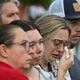 Community members and leaders came together during a community candlelight vigil at Jug Tavern Park on Wednesday. “Fellowship tells us we can’t fix it, but we can help you not go through it by yourself,” the Rev. Dr. Geoffrey Murphy of the Winder First United Methodist Church told the AJC. (Hyosub Shin/AJC)