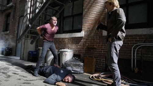 "The Rising" -- Shooting in the Fairlie-Poplar District of downtown Atlanta (but fictionally set in San Francisco in this episode) Angus "Mac" MacGyver (Lucas Till) and Jack Dalton (George Eads), special agents for the Department of External Services (DXS), join forces to recover a missing bioweapon that has the ability to destroy hundreds of thousands of people with one single drop, on the series premiere of the new drama MACGYVER, Friday, Sept. 23 (8:00-9:00 PM, ET/PT), on the CBS Television Network. Lucas Till, George Eads, Sandrine Holt, Justin Hires and Tristin Mays star. Pictured: George Eads, Vinnie Jones, Lucas Till Photo: Annette Brown/CBS ÃÂ©2016 CBS Broadcasting, Inc. All Rights Reserved