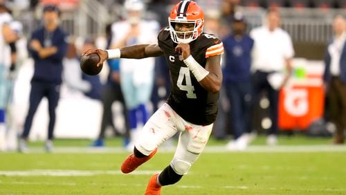 Cleveland Browns quarterback Deshaun Watson (4) runs the ball against the Dallas Cowboys in the second half of an NFL football game in Cleveland, Sunday, Sept. 8, 2024. (AP Photo/Sue Ogrocki)