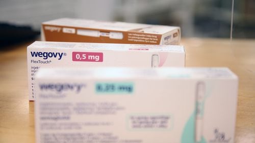 Various packages of the weight-loss drug 'Wegovy' from the pharmaceutical company Novo Nordisk lie on the sales counter in a Danish pharmacy. (Steffen Trumpf/dpa via ZUMA Press/TNS)