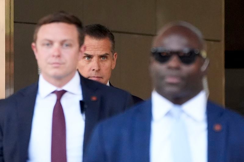 Hunter Biden, center, leaves federal court after pleading guilty in his felony federal tax case, Thursday, Sept. 5, 2024, in Los Angeles. (AP Photo/Jae C. Hong)