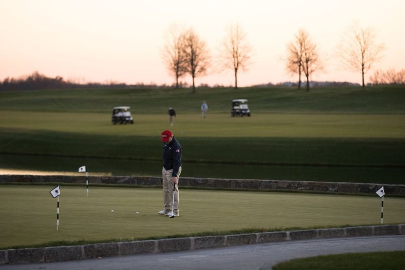 A man practices on the putting green prior to the arrival of President-elect Donald Trump’s motorcade in November at Trump National Golf Club in Bedminster, N.J. (Photo by Drew Angerer/Getty Images)