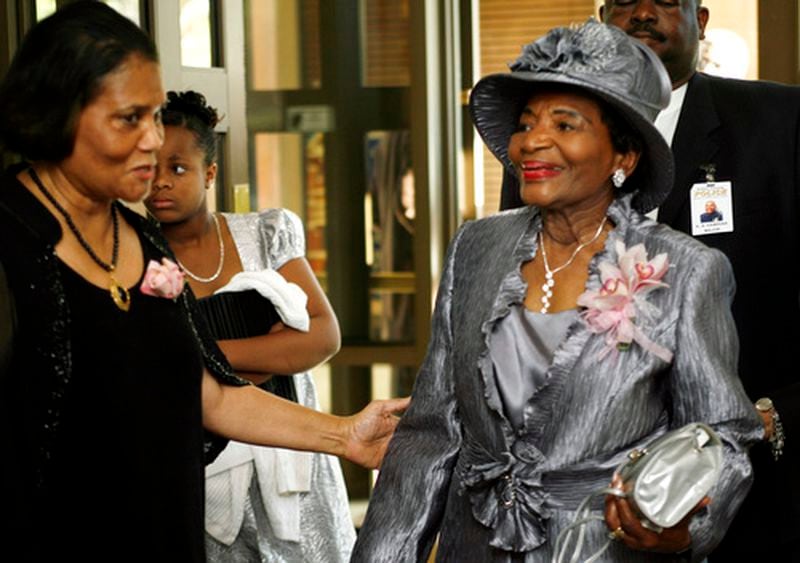 Sylvia Cook (left) greets Dr. Christine King Farris as she arrives at Ebenezer Baptist Church for her 80th birthday celebration Sunday.