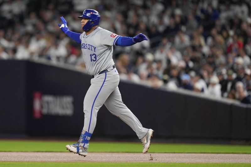 Kansas City Royals' Salvador Perez (13) reacts after hitting a solo home run against the New York Yankees during the fourth inning of Game 2 of the American League baseball playoff series, Monday, Oct. 7, 2024, in New York. (AP Photo/Seth Wenig)