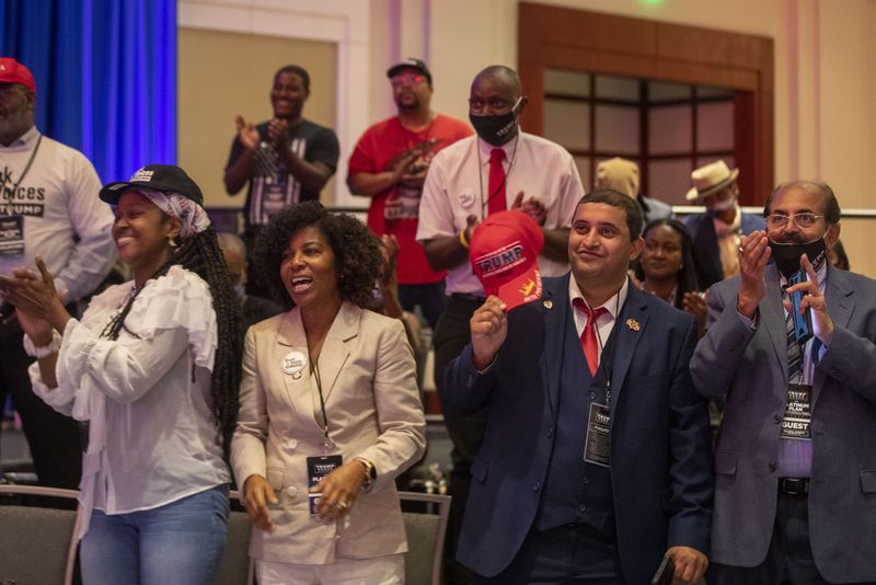 09/25/2020 - Atlanta, Georgia - President Trump supporters cheer during a Blacks for Trump campaign rally at the Cobb Galleria Centre in Atlanta, Friday, September 25, 2020.  (Alyssa Pointer / Alyssa.Pointer@ajc.com)