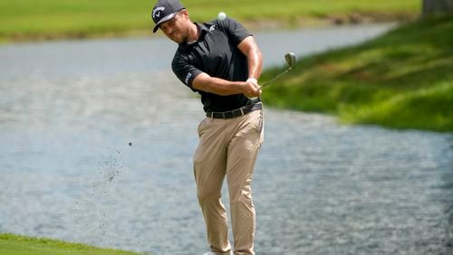 Xander Schauffele chips onto the 18th green during the second round of the St. Jude Championship golf tournament Friday, Aug. 16, 2024, in Memphis, Tenn. (AP Photo/Mark Humphrey)