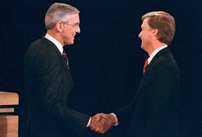 FILE - Sen. Lloyd Bentsen, D-Texas, left, shakes hands with Sen. Dan Quayle, R-Ind., before the start of their vice presidential debate at the Omaha Civic Auditorium, Omaha, Neb., Oct. 5, 1988. (AP Photo/Ron Edmonds, File)