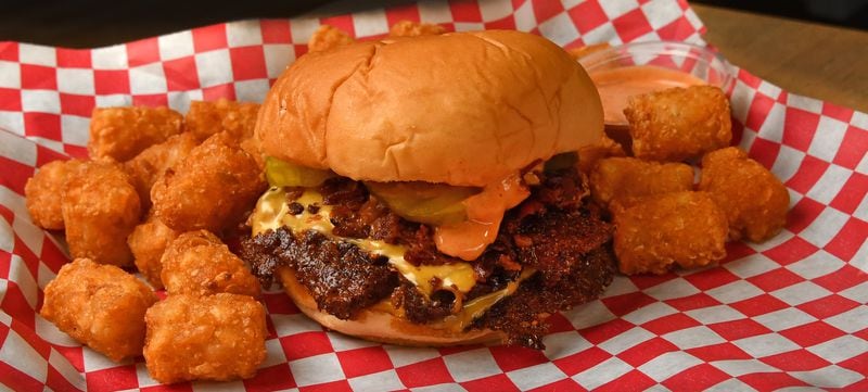 A Double Burger with bacon and a side of Sassy Tots from NFA Burger. (CHRIS HUNT FOR THE ATLANTA JOURNAL-CONSTITUTION)