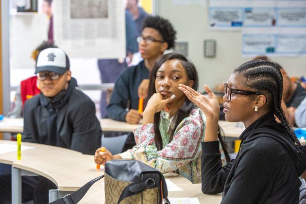 Students participate in an Advanced Placement African American Studies class at Maynard Jackson High School on Friday, Feb 17, 2023, when the class was a pilot in Georgia. Students discussed historic and current events, presented class projects and considered why restrictions are being put on the course in other states. (Jenni Girtman for The Atlanta Journal-Constitution)