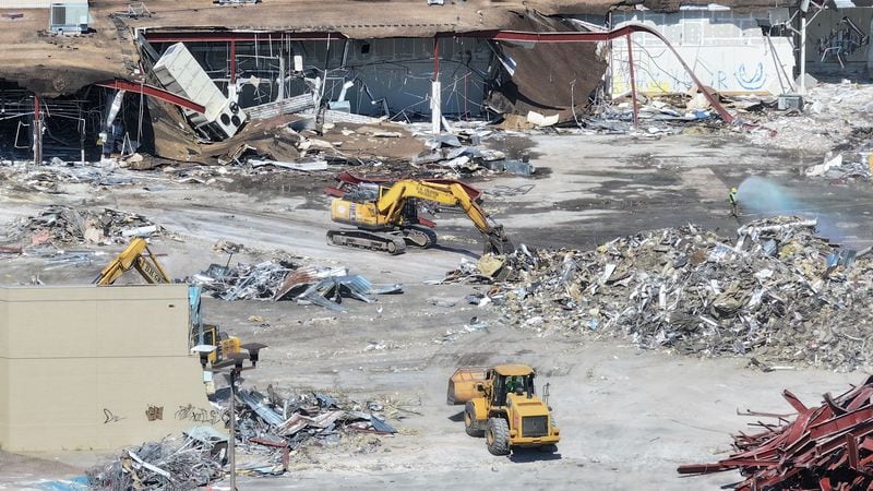 An aerial image depicts bulldozers demolishing one side of the North Deaklb Mall on Wednesday, June 26, 2024, signaling the commencement of efforts for a new multi-use development.
(Miguel Martinez / AJC)