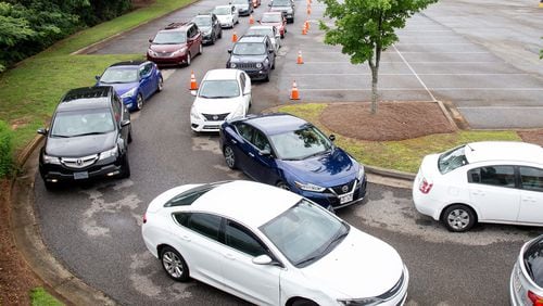 Cars line up at the COVID 19 testing center at Greenforest Community Baptist Church in Decatur July 01, 2020. STEVE SCHAEFER FOR THE AJC