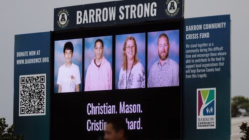 A electronic billboard showing 14-year-old Apalachee High School students Christian Angulo and Mason Schermerhorn and teachers Cristina Irimie and Richard Aspinwall is seen at a vigil at Jug Tavern Park in Winder on Friday, Sept. 6, 2024. A 14-year-old Apalachee High School student is accused of shooting and killing the four and injuring nine others at the Barrow County high school on Wednesday.