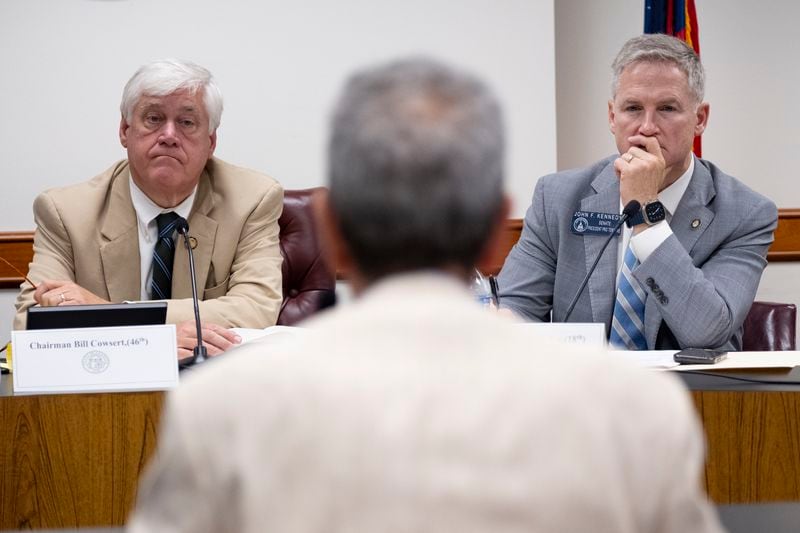 Sen. Bill Cowsert, left, (R-Athens) chair of the Senate Special Committee on Investigations, and Sen. John Kennedy (R-Macon) listen to testimony from former Gwinnett District Attorney Danny Porter during a hearing at the State Capitol on Friday, Aug. 9, 2024.   (Ben Gray / Ben@BenGray.com)