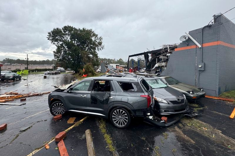 In this photo provided by the City of Rocky Mount, debris and smashed vehicles are scattered across a parking lot near Hing Ta Restaurant after a tornado hit Rocky Mount, N.C., Friday, Sept. 27, 2024. (City of Rocky Mount via AP)