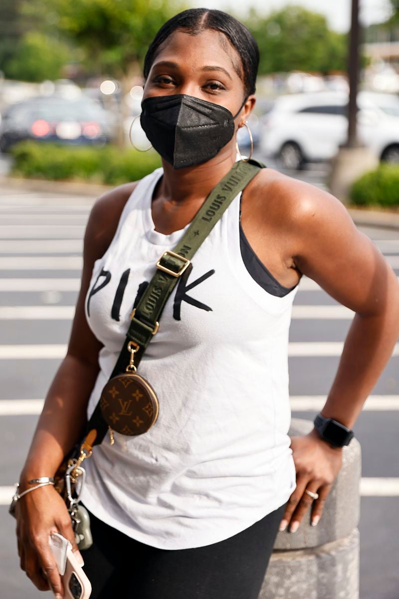 Nickie Tingle, 38, says that her whole family still wears masks. Her teenaged daughter got sick with COVID late last year, and “brought it home," she said. "We all got it.” (Natrice Miller / natrice.miller@ajc.com)