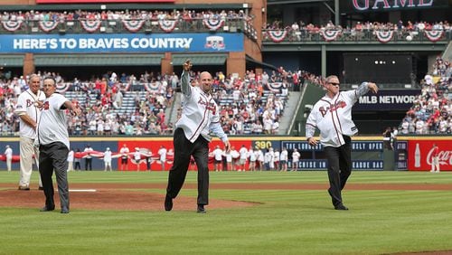 Hall of Fame manager Bobby Cox (from left) looks on as Hall of Fame pitchers Greg Maddux, John Smoltz, and Tom Glavine throw out the first pitch for the Braves final game at Turner Field on Sunday, Oct. 2, 2016, in Atlanta. Curtis Compton /ccompton@ajc.com