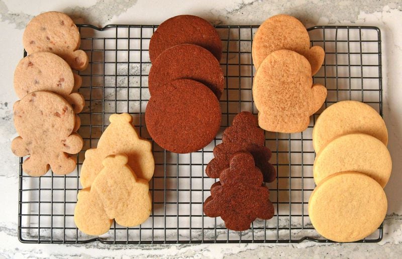 This Vanilla Sugar Cookies recipe can be tweaked to produce various flavors. Shown here are cookies in the flavors of (from left) cinnamon, lemon, chocolate peppermint, chocolate, pumpkin spice and vanilla. (Styling by Sam Opdenbosch / Chris Hunt for the AJC)