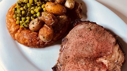 King + Duke's Sunday roast includes prime rib, roasted potatoes, spring peas with mint and steel pudding. Bob Townsend for The AJC