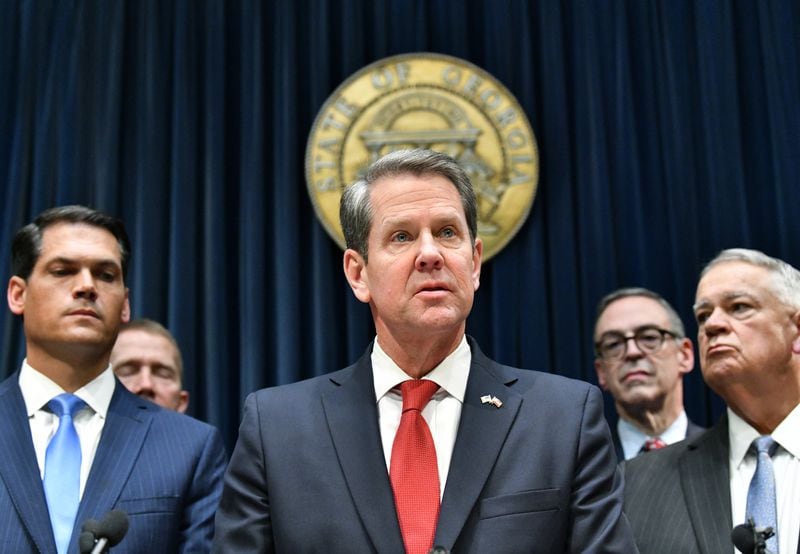 Kemp appears at a press conference in March 2020 with Lt. Gov. Geoff Duncan, left, and House Speaker David Ralston. (Hyosub Shin / Hyosub.Shin@ajc.com)