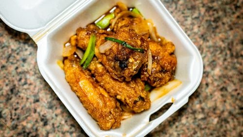 The fish sauce chicken wings from Anh's Kitchen in Midtown can be addictive. Henri Hollis for The Atlanta Journal-Constitution.