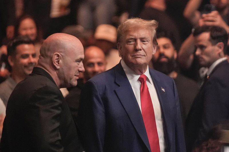 Former President Donald Trump, right, talks to Dana White while attending the UFC 302 mixed martial arts event Saturday, June 1, 2024, in Newark, N.J. (AP Photo/Frank Franklin II)