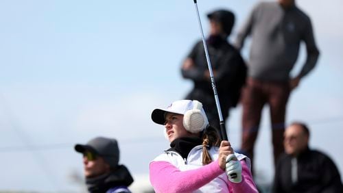 Sweden's Linn Grant plays her tee shot from the 8th during the first round of the Women's British Open golf championship, in St Andrews, Scotland Thursday, Aug. 22, 2024. (AP Photo/Scott Heppell)