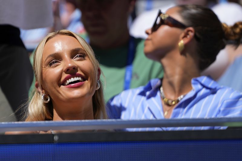 Morgan Riddle watches play between Taylor Fritz, of the United States, and Alexander Zverev, of Germany, during the quarterfinals of the U.S. Open tennis championships, Tuesday, Sept. 3, 2024, in New York. (AP Photo/Kirsty Wigglesworth)