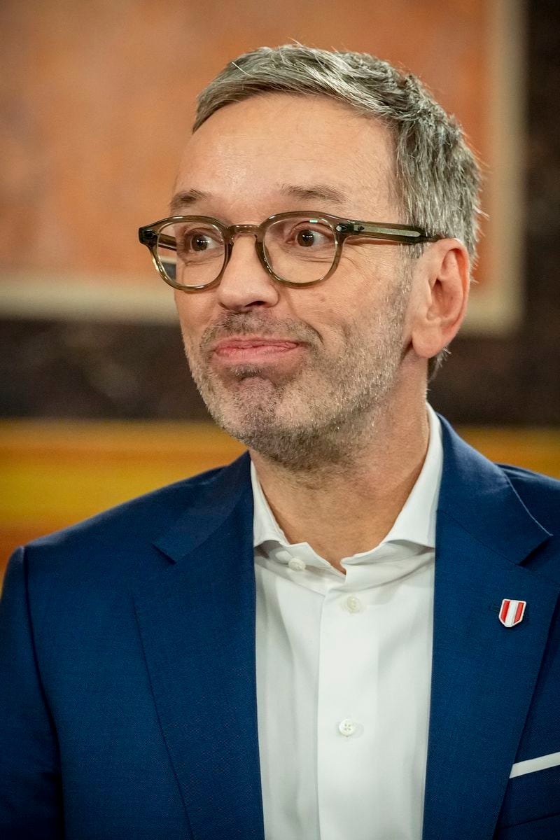 Herbert Kickl, leader of the Freedom Party of Austria smiles while standing at the national broadcaster studio, set up in the parliament building, in Vienna, Austria, Sunday, Sept. 29, 2024, after polls closed in the country's national election. (AP Photo/Andreea Alexandru)