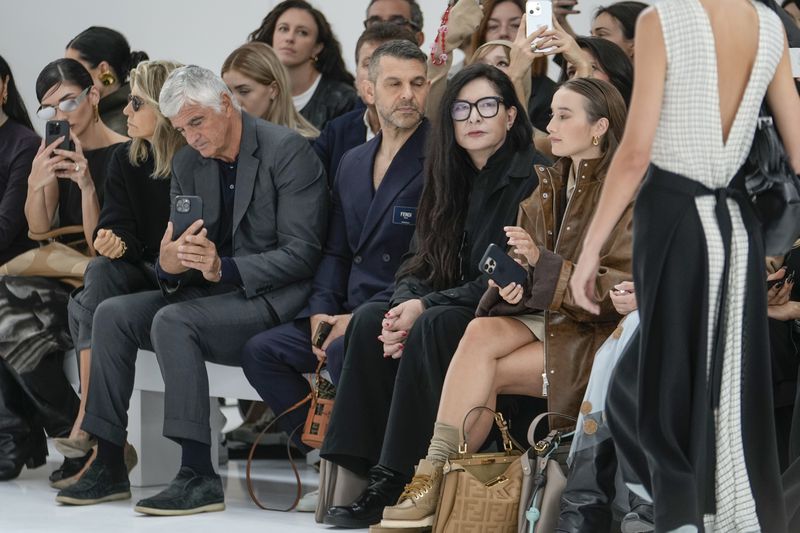 Marina Abramovic, second from right front row, attends the Fendi Spring Summer 2025 collection, that was presented in Milan, Italy, Tuesday, Sept. 17, 2024. (AP Photo/Luca Bruno).