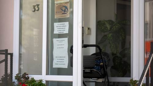 This shows a sing featuring the names of several companies on the door of a house where a Hungarian company that allegedly manufactured pagers that exploded in Lebanon and Syria is headquartered in Budapest Wednesday, Sept. 18, 2024. (AP Photo/Denes Erdos)