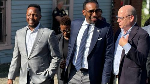 Mayor Andre Dickens (center) walks the Vine City neighborhood on Monday, Sept. 16, 2024 with his senior advisor Courtney English (left) and Westside Future Fund CEO and president John Ahmann (right). (Matt Reynolds/AJC)