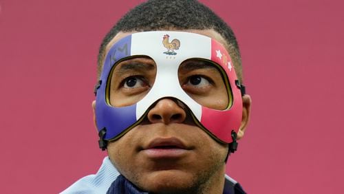France's Kylian Mbappe gestures as he wears a face mask during a training session in Leipzig, Germany, Thursday, June 20, 2024. France will play against Netherland during their Group D soccer match at the Euro 2024 soccer tournament on June 21. (AP Photo/Hassan Ammar)