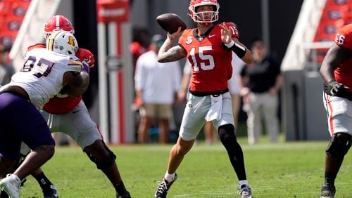 Georgia quarterback Carson Beck (15) throws a pass during the first half of an NCAA college football game against Tennessee Tech Saturday, Sept. 7, 2024, in Athens, Ga. (AP Photo/John Bazemore)