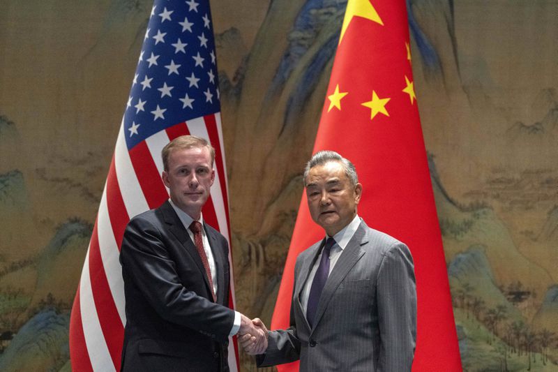 Wang Yi, right, the director of the Communist Party's Central Foreign Affairs Commission Office shakes hands with White House national security adviser Jake Sullivan, left, at Yanqi lake in Beijing, Tuesday, Aug. 27, 2024. (AP Photo/Ng Han Guan Pool)