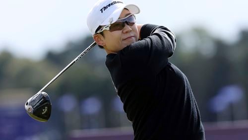 Korea's Jiyai Shin plays her shot at the 4th tee during the third round of the Women's British Open golf championship, in St Andrews, Scotland Saturday, Aug. 24, 2024. (AP Photo/Scott Heppell)