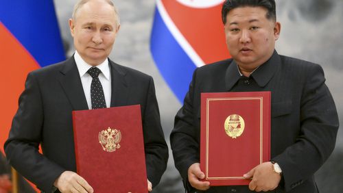 Russian President Vladimir Putin, left, and North Korea's leader Kim Jong Un pose for a photo during a signing ceremony of the new partnership in Pyongyang, North Korea, on Wednesday, June 19, 2024. Putin and North Korean leader Kim Jong Un signed a new partnership that includes a vow of mutual aid if either country is attacked, during a Wednesday summit that came as both face escalating standoffs with the West. (Kristina Kormilitsyna, Sputnik, Kremlin Pool Photo via AP)