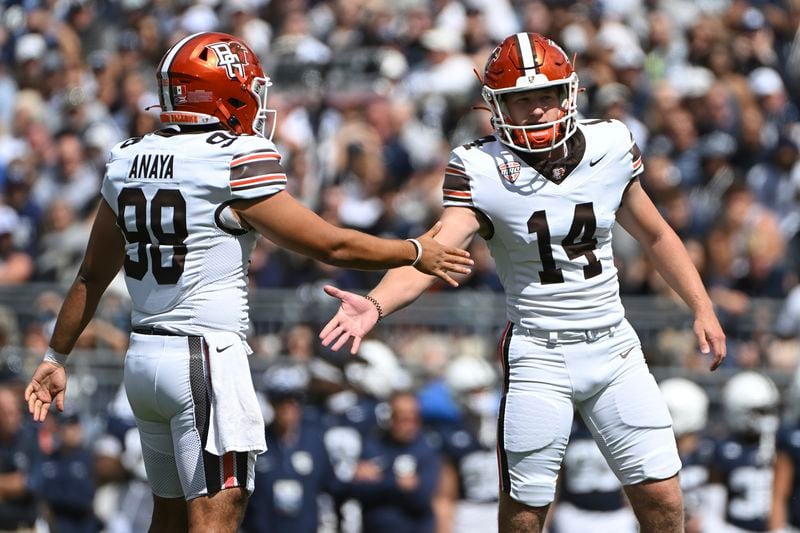 Bowling Green kicker Jackson Kleather (14) celebrates a field goal with Alan Anaya (98) during the first quarter of an NCAA college football game against Penn State, Saturday, Sept. 7, 2024, in State College, Pa. (AP Photo/Barry Reeger)