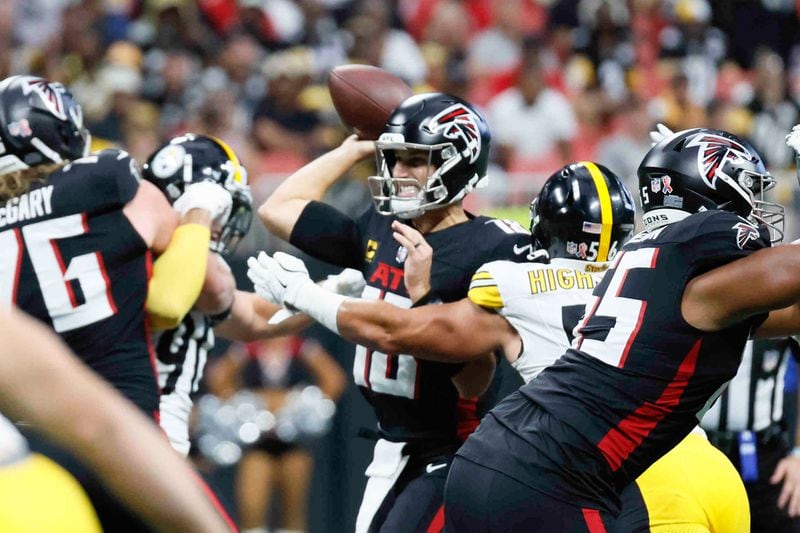 Atlanta Falcons quarterback Kirk Cousins (18) attempts to pass under pressure during the first half of an NFL football game against the Pittsburgh Steelers on Sunday, Sept. 8, at Mercedes-Benz Stadium in Atlanta. 
(Miguel Martinez/ AJC)