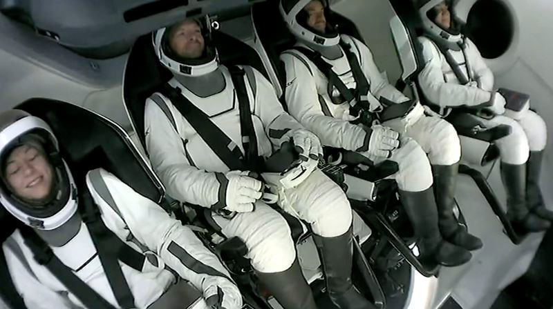 This image made from SpaceX video shows the four-member crew including tech entrepreneur Jared Isaacman, third left, seated in its capsule as they wait to get off the capsule after it landed in the Gulf of Mexico near Florida's Dry Tortugas early Sunday, Sept. 15, 2024. (SpaceX via AP)