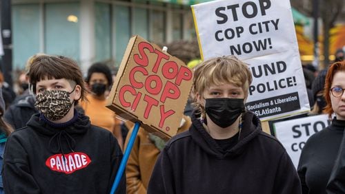 Forest Defender protesters gathered for a rally near Underground Atlanta Saturday, Jan. 21, 2023. Atlanta Police Department said several people were arrested after a Police car was set afire.  (Steve Schaefer/steve.schaefer@ajc.com)