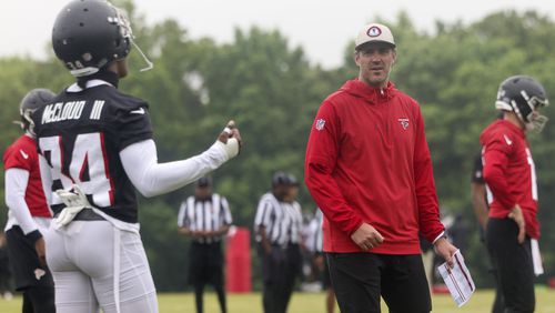 Atlanta Falcons offensive coordinator Zac Robinson talks with wide receiver Ray-Ray McCloud (34) during minicamp at the Atlanta Falcons Training Camp, Tuesday, May 14, 2024, in Flowery Branch, Ga. (Jason Getz / AJC)
