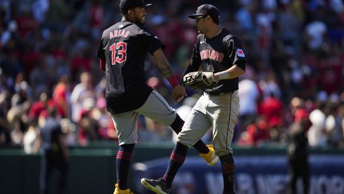 Cleveland Guardians third baseman Gabriel Arias (13) and center fielder Tyler Freeman celebrate after a 5-4 win over the Los Angeles Angels in a baseball game in Anaheim, Calif., Sunday, May 26, 2024. (AP Photo/Ashley Landis)