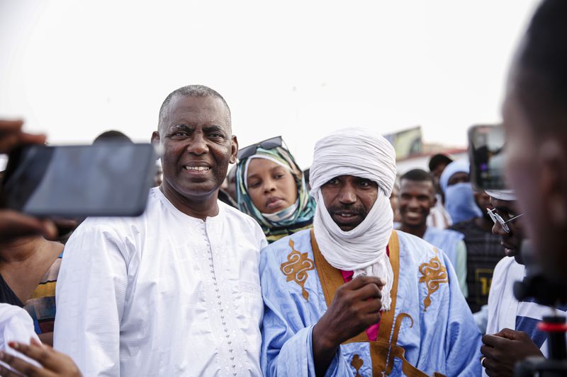 Presidential candidate Biram Ould Dah Ould Abeid, left, takes part in a rally among his supporters, ahead of the presidential election end of the month, in Nouakchott, Mauritania, Monday, June 24, 2024. (AP Photo/Mamsy Elkeihel)