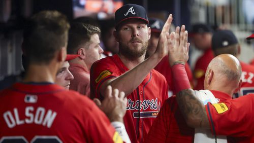 Atlanta Braves starting pitcher Chris Sale greets teammates in the dugout after pitching through the seventh inning against the Tampa Bay Rays at Truist Park, Friday, June 14, 2024, in Atlanta. (Jason Getz / AJC)
