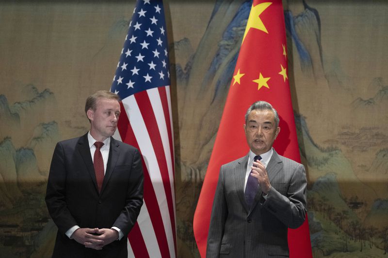 Wang Yi, right, the director of the Communist Party's Central Foreign Affairs Commission Office speaks as White House national security adviser Jake Sullivan, left, listens to Wang, before their talk at Yanqi lake in Beijing, Tuesday, Aug. 27, 2024. (AP Photo/Ng Han Guan, Pool)