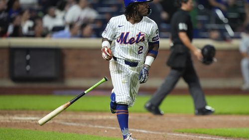 New York Mets' Luisangel Acuna tosses his bat as he runs the bases after hitting a home run during the eighth inning of a baseball game against the Washington Nationals, Tuesday, Sept. 17, 2024, in New York. (AP Photo/Frank Franklin II)