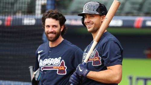 Braves first baseman Matt Olson (right) shares a laugh with shortstop Dansby Swanson as they prepare to take batting practice in mid-March at CoolToday Park in North Port, Fla. (Curtis Compton/Atlanta Journal-Constitution)