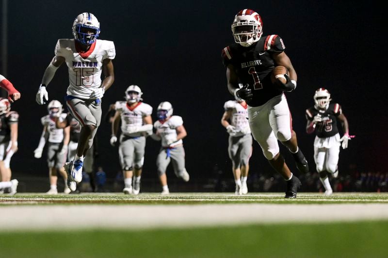 Hillgrove running back Teonte Reed (1) blasts past Waltons defense to score a touchdown in the first half of play Friday, Oct. 8, 2021 at Hillgrove High School. (Daniel Varnado/For the Atlanta Journal-Constitution